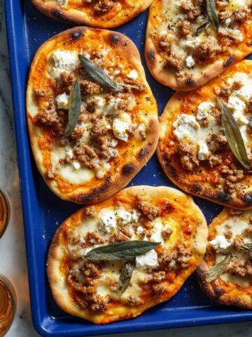 Autumn Naan Pizzas with Caramelized Shallots, Pumpkin, Sausage, and Sage Recipe
