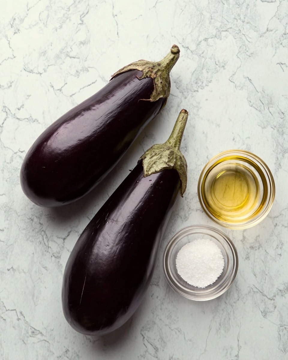 Two whole, dark purple eggplants with green stems lie side by side on a white marbled surface. Nearby are two small clear glass bowls, one filled with white salt and the other with a light yellow liquid, likely oil. The arrangement is simple with the objects spaced apart on the textured background. photo taken with an iphone --ar 4:5 --v 7