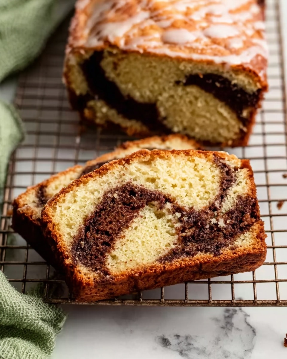 The image shows a slice of loaf cake placed on a metal cooling rack over a white marbled surface. The cake has two main layers: a light golden brown soft cake layer with a slightly crumbly texture and a dark brown swirled layer of filling that looks moist and rich, running through the middle and slightly towards the edges. The top edge of the slice has a light glaze that adds a hint of shine. The image also shows part of the loaf beside the slice, with a similar golden brown crust and the dark swirl running inside. A woman's hand with a green cloth is partially visible at the bottom left corner, and the overall look is warm and homey. Photo taken with an iphone --ar 4:5 --v 7