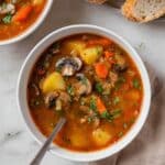 Hearty Vegetable Stew with Potatoes, Mushrooms, Carrots, and Thyme Recipe