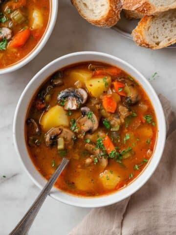 Hearty Vegetable Stew with Potatoes, Mushrooms, Carrots, and Thyme Recipe