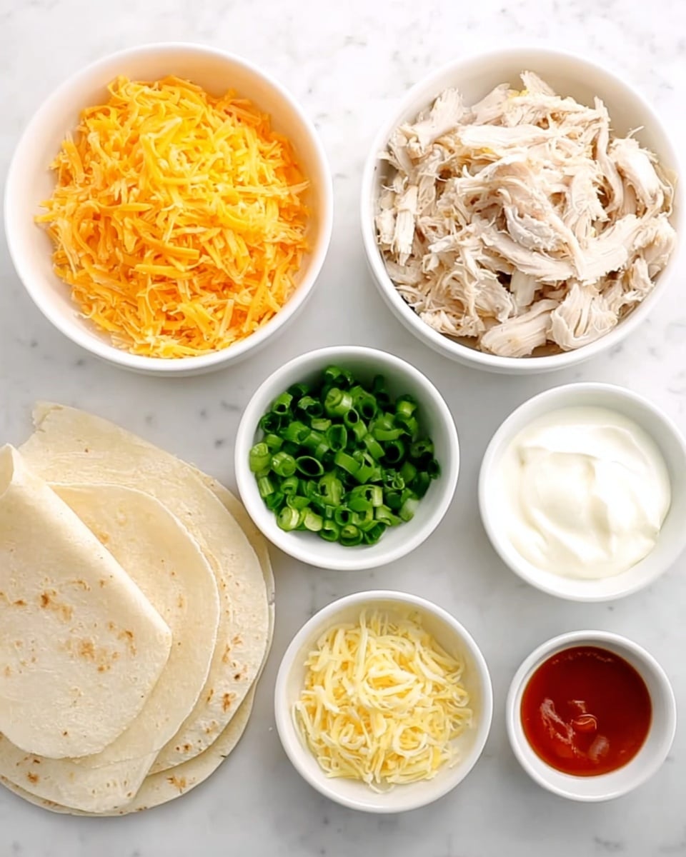 The image shows a flat lay of several white bowls on a white marbled surface, each filled with different ingredients arranged neatly. There is one bowl with shredded cooked chicken meat that is pale tan and white, another with bright orange shredded cheddar cheese, one with finely chopped green onions, and a bowl filled with shredded light yellow cheese. Three smaller bowls hold white sour cream, pale yellow minced garlic, and a small amount of red hot sauce. To the side, there are three light beige soft flour tortillas stacked and slightly overlapping. The whole setup is clean and bright. Photo taken with an iphone --ar 4:5 --v 7