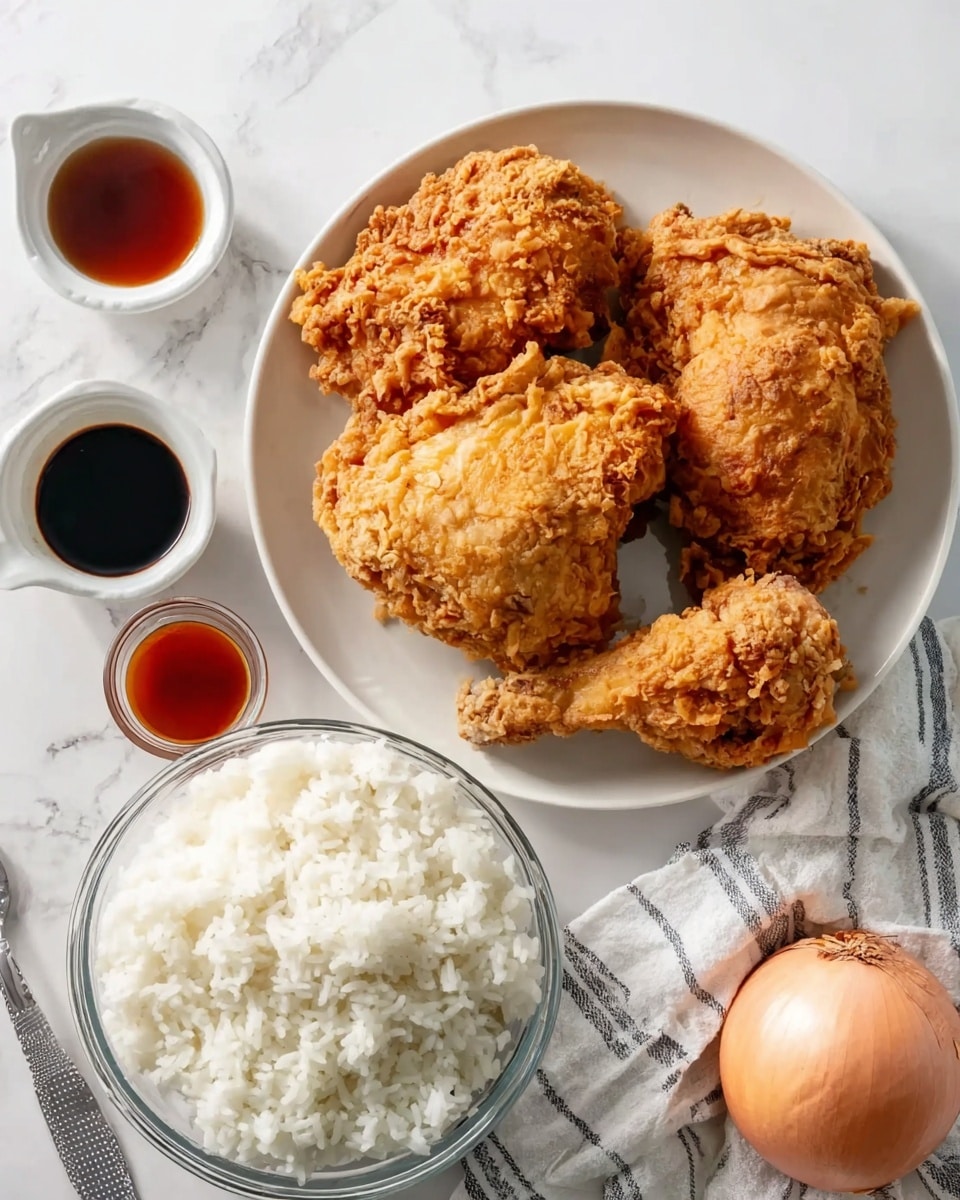 The image shows three pieces of golden-brown fried chicken on a large white plate, with crispy and textured skin visible on each piece. Below the plate, there is a clear glass bowl filled with fluffy white rice. To the left of the bowl, there are three small white ramekins with different sauces: a dark soy sauce, a reddish sauce, and a small glass with a darker liquid. On the right side of the frame, a whole light brown onion is placed on a white marbled surface next to a striped cloth napkin. The lighting is bright, highlighting the contrasting textures and colors. Photo taken with an iphone --ar 4:5 --v 7