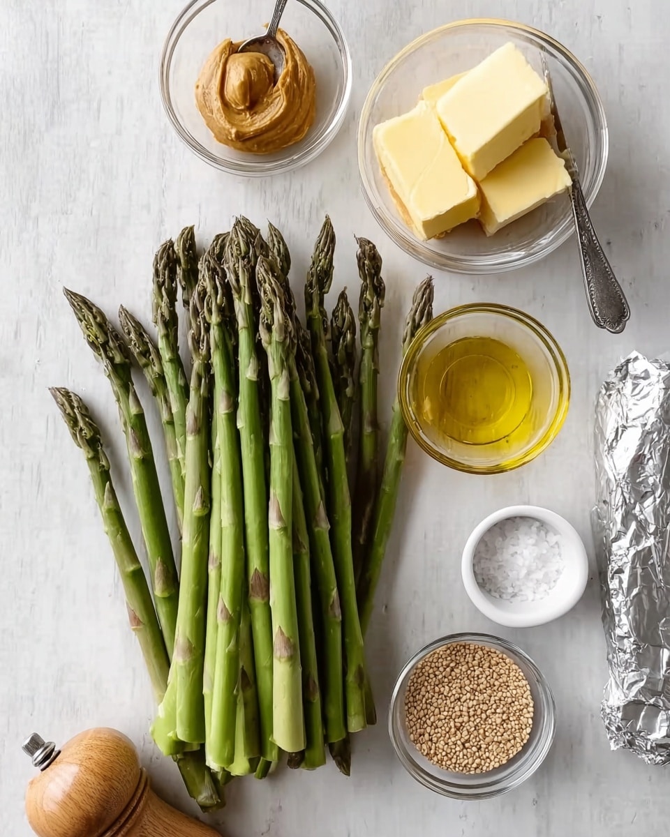 The image shows fresh green asparagus spears arranged in a neat bunch on a white marbled surface. Around the asparagus, there are small clear glass bowls holding different ingredients: one has a small amount of peanut butter, another contains golden yellow oil, one bowl has a pile of light brown seeds, and a white bowl of salt is placed near a pepper grinder with a wooden top. A pat of butter partially wrapped in silver foil is also visible by the side. photo taken with an iphone --ar 4:5 --v 7
