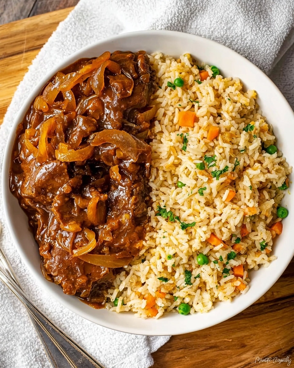 A white bowl contains two main layers side by side. On the left side, there is a thick layer of brown cooked meat covered with a glossy, thick onion sauce that looks soft and caramelized, with visible onion slices spread over the meat. On the right side, there is a fluffy layer of rice mixed with small pieces of orange carrot, green peas, and some herbs. The bowl is placed on a wooden surface with a white towel nearby and a silver fork to the lower left. Photo taken with an iphone --ar 4:5 --v 7