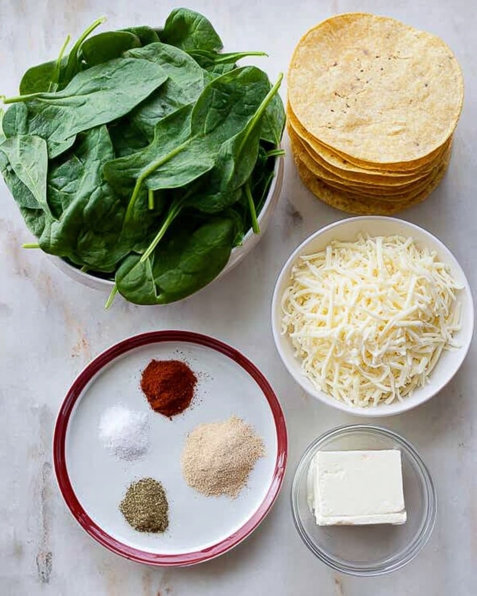 The image shows ingredients neatly arranged on a white marbled textured surface. There is a pile of fresh green spinach leaves on the left, a white bowl full of shredded white cheese at the top center, and a neat stack of yellow corn tortillas to the right. Below these, a white plate with a red rim holds four different spices in small piles: salt, reddish powder, beige powder, and greenish powder. Next to this plate, on the right, is a small glass bowl containing a white block of cream cheese. photo taken with an iphone --ar 4:5 --v 7