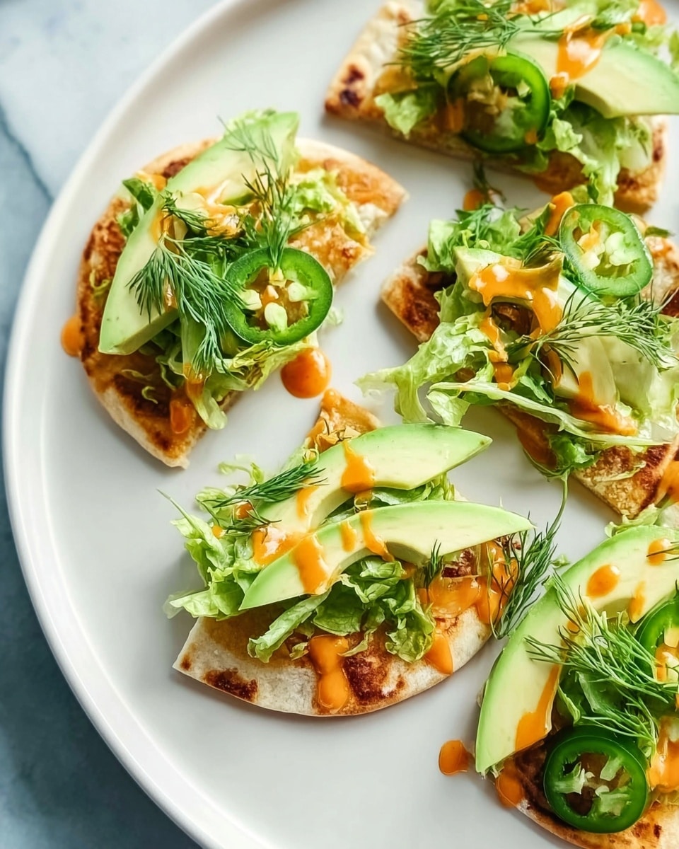 The image shows small flatbread pieces on a white plate, each topped with several layers: a base of lightly browned flatbread with a slightly crispy texture; a layer of fresh green lettuce leaves; thin slices of bright green jalapeño peppers; half slices of avocado, creamy and light green; drizzles of orange sauce adding a bit of shine; and small sprigs of fresh dill on top for a delicate touch. The plate sits on a white marbled surface. photo taken with an iphone --ar 4:5 --v 7