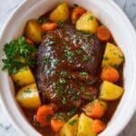 Slow Cooker Pot Roast with Carrots, Potatoes, and Herb Gravy Recipe