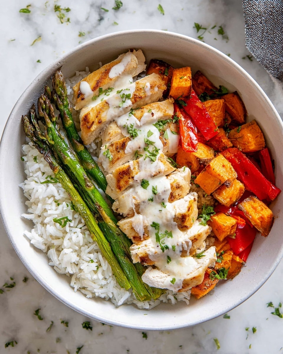 A white bowl filled with three main layers: the bottom layer is plain white rice with a soft, fluffy texture; on the right side, there are roasted vegetables including bright green asparagus, red bell pepper pieces, and golden-brown sweet potato cubes with a slightly crispy look; on the left, sliced cooked chicken with a light golden-brown color sits on top of the rice, drizzled with a creamy white sauce and sprinkled with finely chopped green herbs for garnish; the bowl is placed on a white marbled surface with some scattered herbs around. Photo taken with an iphone --ar 4:5 --v 7