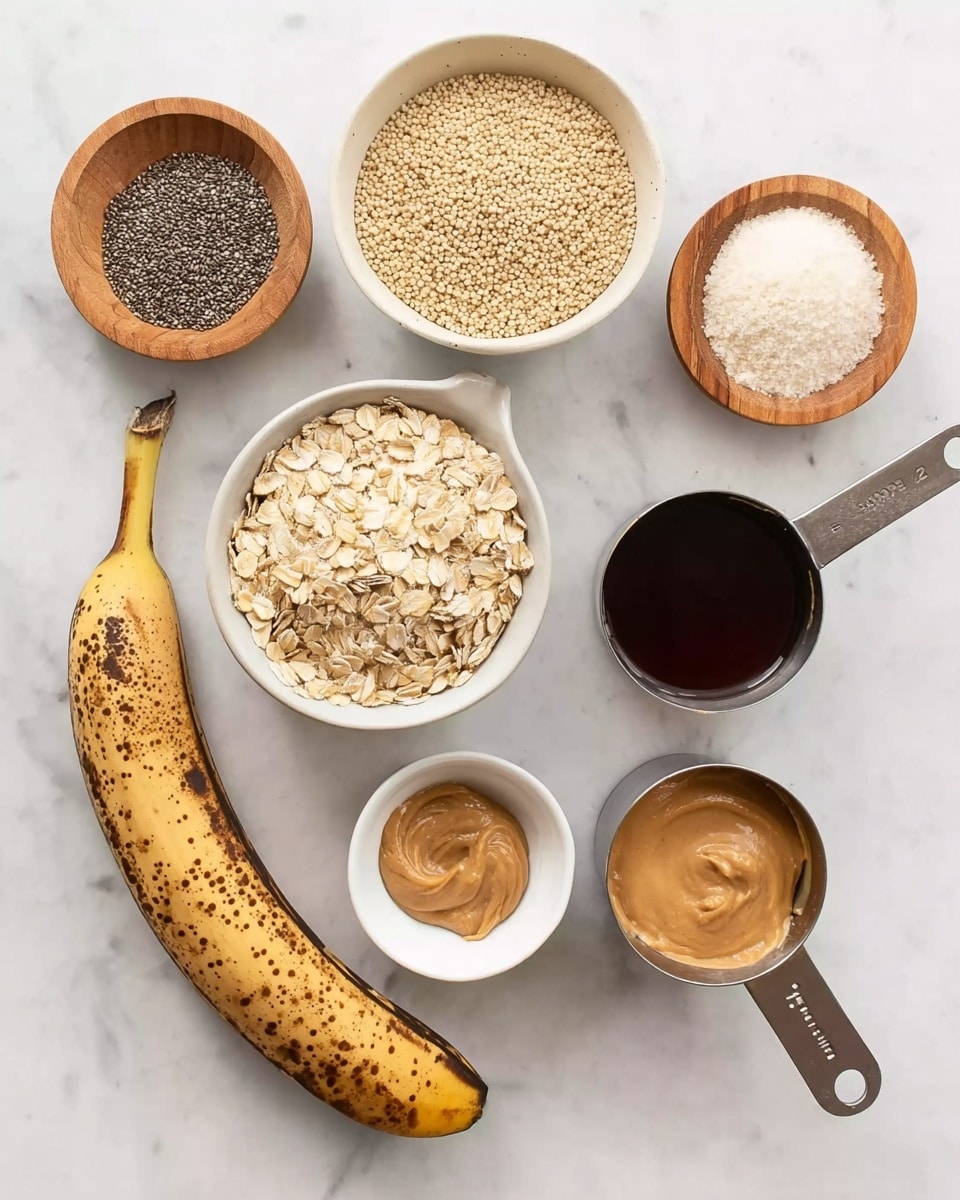 The image shows ingredients arranged neatly on a white marbled surface. There is one ripe banana with brown spots, a small white bowl with light brown cooked quinoa, and a medium white bowl filled with a light brown grainy mixture. A metal measuring cup holds pale beige rolled oats. A small wooden bowl contains tiny black and white chia seeds, and another small wooden bowl has white powder, likely baking soda or salt. There is a metal measuring cup filled with light beige creamy peanut butter, and another metal measuring cup with dark brown liquid, probably maple syrup. A very small white bowl holds a dark brown syrup, placed near the banana. photo taken with an iphone --ar 4:5 --v 7