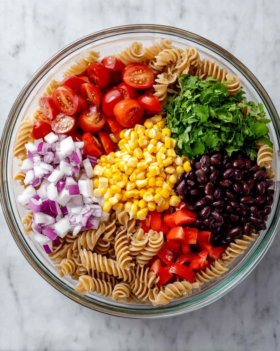 A clear glass bowl filled with six separate layers of food on a white marbled surface. The bottom layer is light brown spiral pasta that forms a base in the bowl. On top of the pasta, cherry tomatoes, sliced in half, show bright red insides with a shiny texture. Next to the tomatoes is a pile of small, bright orange-yellow corn kernels. Beside the corn, there is green chopped cilantro with fresh leafy texture. Above the cilantro, there are small diced white and purple onions. The final two layers are finely chopped red bell peppers with a glossy look and a mound of shiny black beans. The layers are organized clearly and look fresh. Photo taken with an iphone --ar 4:5 --v 7