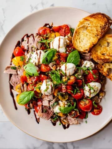 Grilled Skirt Steak with Cherry Tomatoes, Burrata, and Basil Recipe