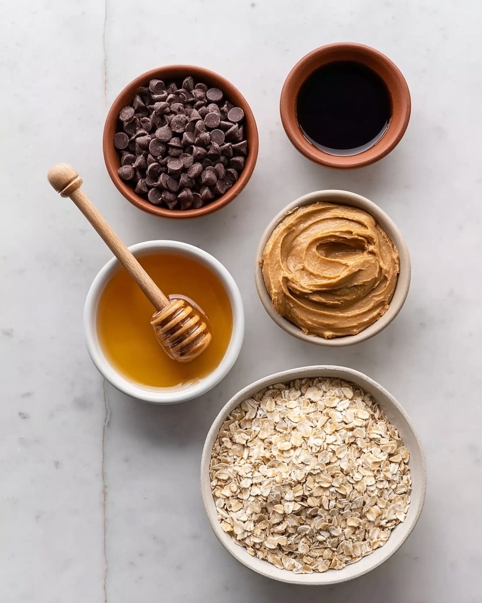 The image shows five small bowls arranged on a white marbled surface. The largest bowl is white and filled with dry oats, placed at the bottom right. To its left is a small white bowl holding golden honey, with a wooden honey dipper resting on top. Above the honey is a medium-sized white bowl filled with smooth, creamy peanut butter. To the upper left, a brown bowl holds a pile of dark brown chocolate chips. At the top center, a small brown bowl contains a dark liquid, possibly vanilla or syrup. Each bowl clearly shows the texture and color of its contents, creating a clear and neat arrangement. Photo taken with an iphone --ar 4:5 --v 7