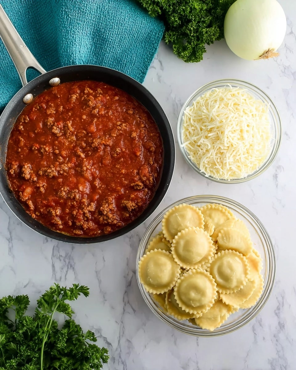 The image shows three main food elements arranged on a white marbled surface. On the left, there is a black pan with a silver handle filled with thick red tomato sauce with visible ground meat. To the right of the pan are two clear glass bowls: the top bowl contains white shredded cheese, and the bottom bowl is filled with round uncooked ravioli pasta with a soft yellow color and slightly scalloped edges. In the top right corner next to the bowls, there is a whole white onion and a bunch of fresh green parsley. A teal cloth is partially visible in the top left corner of the image. Photo taken with an iphone --ar 4:5 --v 7