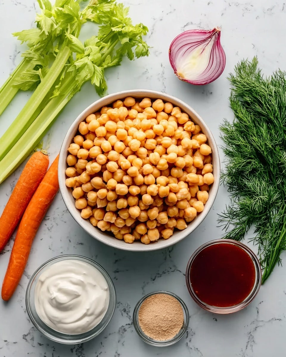 A white bowl filled with a large pile of yellow chickpeas sits in the center on a white marbled surface. To the left of the bowl are three stalks of celery, one bright orange carrot, and fresh green herb sprigs of cilantro and dill. To the right, there is a half of a red onion with visible layers and a small white bowl filled with a light brown powder. Below the main bowl are two small glass bowls: one with smooth white yogurt and the other with a dark red sauce. The scene is well lit and all ingredients are clearly visible, arranged neatly around the main bowl. photo taken with an iphone --ar 4:5 --v 7