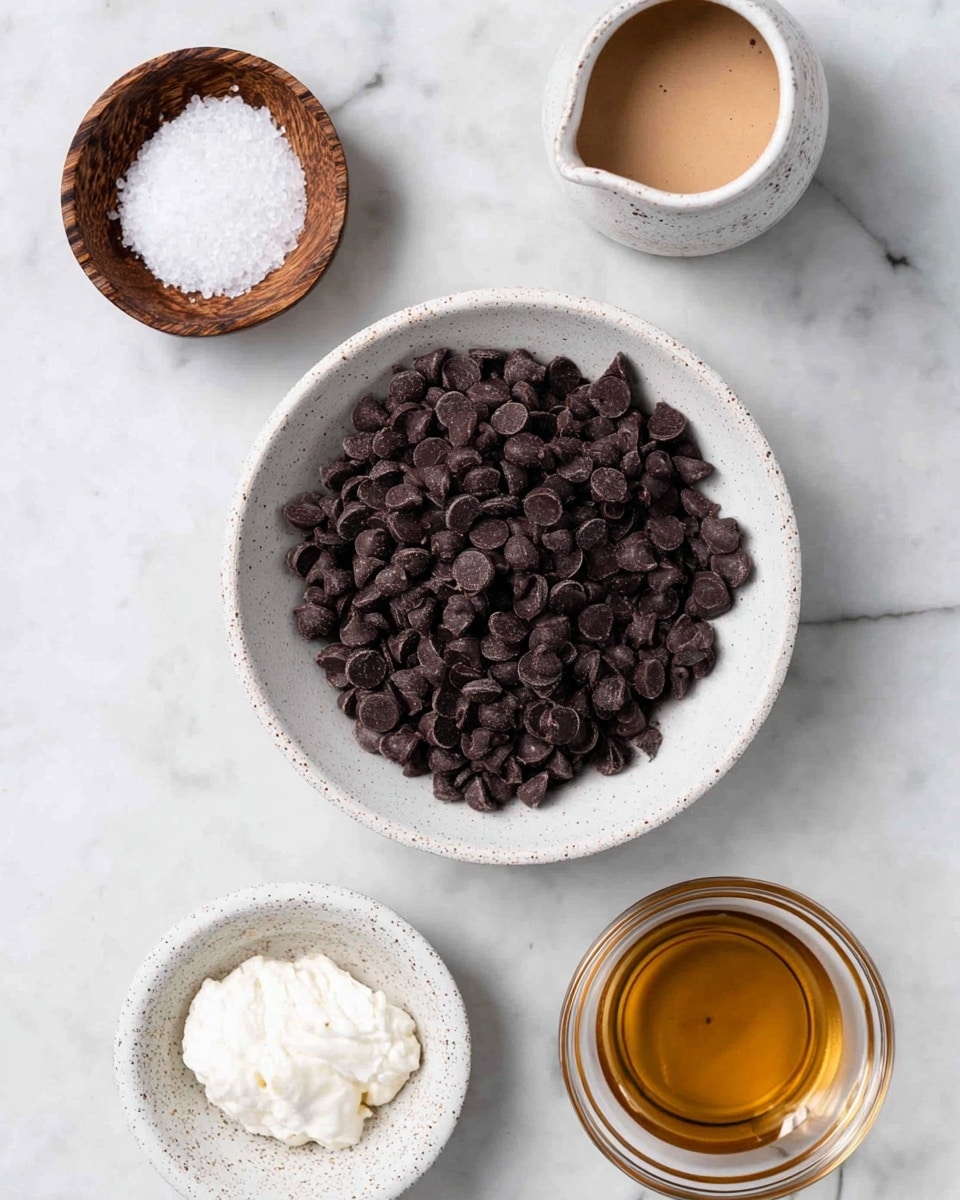 A top view of a white bowl filled with a pile of dark brown chocolate chips in the center on a white marbled surface. Surrounding the bowl are four smaller containers: a wooden bowl with white coarse salt on the bottom left, a white speckled bowl holding thick white cream below, a clear glass bowl with light golden liquid on the bottom right, a white speckled small jug filled with dark brown liquid on the top right, and a clear glass bowl with light brown creamy mixture on the top center. Everything is arranged neatly and evenly spaced. Photo taken with an iphone --ar 4:5 --v 7