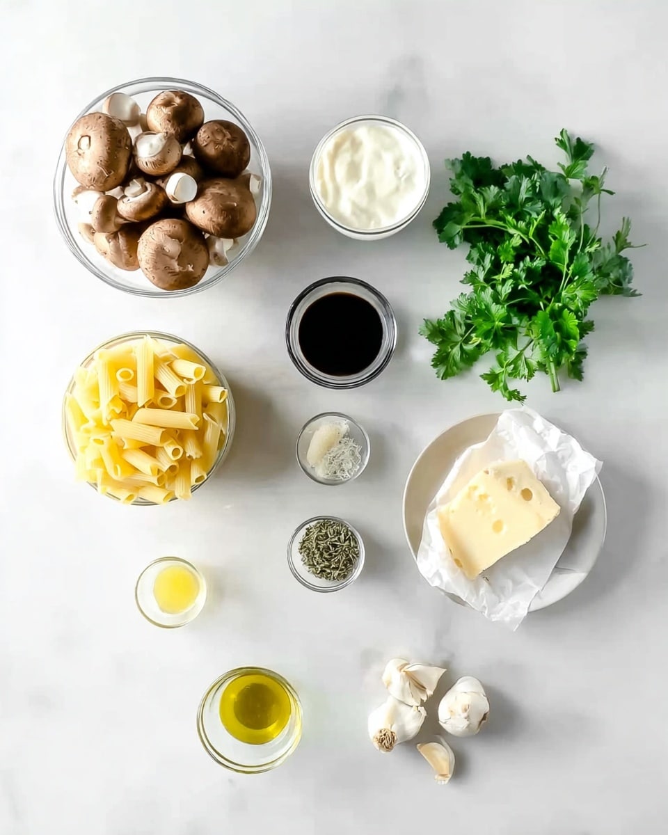 The image shows an organized layout of ingredients on a white marbled surface, each in a clear or white bowl or placed directly on the surface. At the top left, there is a round clear bowl filled with whole brown mushrooms with smooth caps. To the right is a small white bowl of cream, round in shape. Below, fresh green parsley with bright leaves is placed directly on the surface. Next to the parsley, a clear bowl holds pale yellow tubular pasta. Below the pasta is a round white plate with a wedge of pale yellow cheese, partly wrapped in white paper. To the left of the cheese is a small clear bowl with dark balsamic vinegar. Beneath the cheese and vinegar is a small white bowl with a mix of finely minced garlic and dried herbs. To the bottom right, three small cloves of garlic rest on the surface. Next to the garlic, a clear bowl contains small white chunks of butter, and to the bottom center is a small clear bowl of light olive oil. At the bottom left corner, another clear bowl holds ground black pepper. Everything is cleanly arranged and the light-colored setup looks fresh and simple photo taken with an iphone --ar 4:5 --v 7