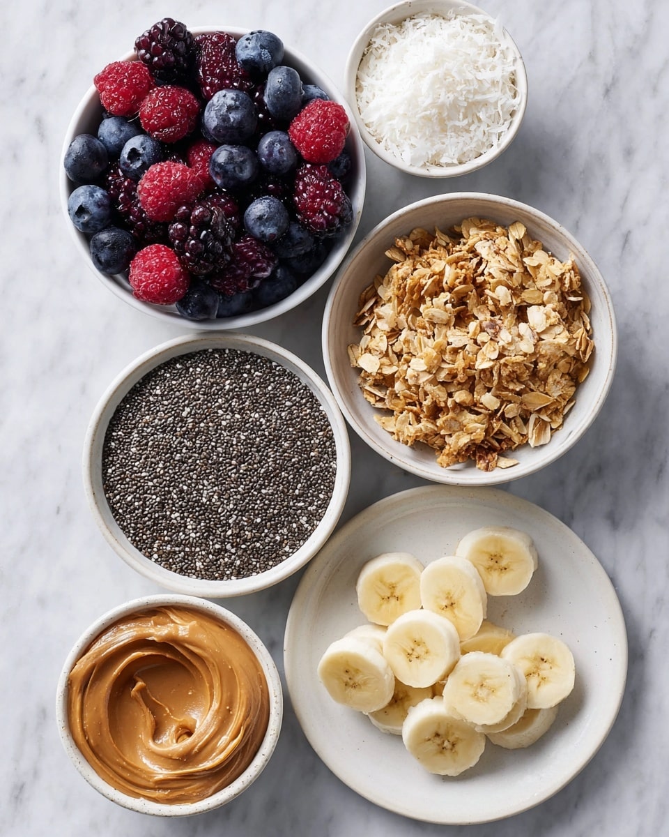 The image shows six small white bowls placed on a white marbled surface, each containing different ingredients. One bowl is full of mixed fresh berries including blueberries, raspberries, and blackberries, all vibrant and plump. Next to it, a bowl holds golden brown granola with oat flakes and some coconut pieces, textured and crunchy looking. Another bowl contains black and white chia seeds with a smooth, speckled look. There is also a bowl filled with fine white shredded coconut, soft and fluffy in appearance. A small white plate features evenly sliced banana pieces laid flat. The last bowl contains smooth, creamy brown peanut butter with a slightly shiny surface. Photo taken with an iphone --ar 4:5 --v 7