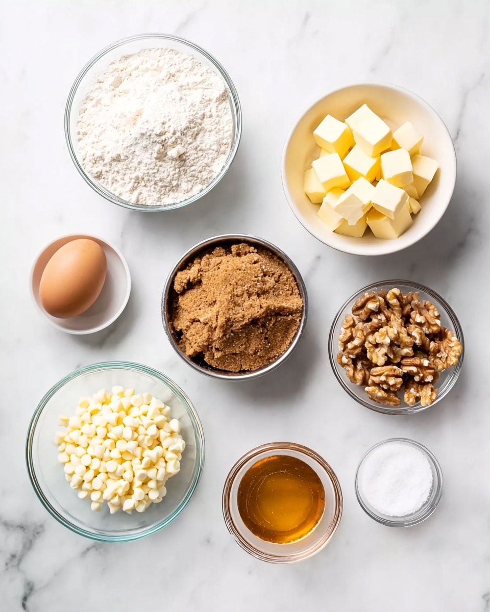 Seven clear glass and metal bowls are arranged on a white marbled surface in a loose circle. Each bowl holds a separate baking ingredient: one with white flour, one with several small cubes of yellow butter, a metal bowl with packed light brown sugar, one with light brown walnuts, a white bowl filled with white chocolate chips, a single light brown egg, a small glass bowl with amber honey, and a small empty glass bowl. The top-down view shows a clean, bright kitchen setup with natural light. Photo taken with an iphone --ar 4:5 --v 7