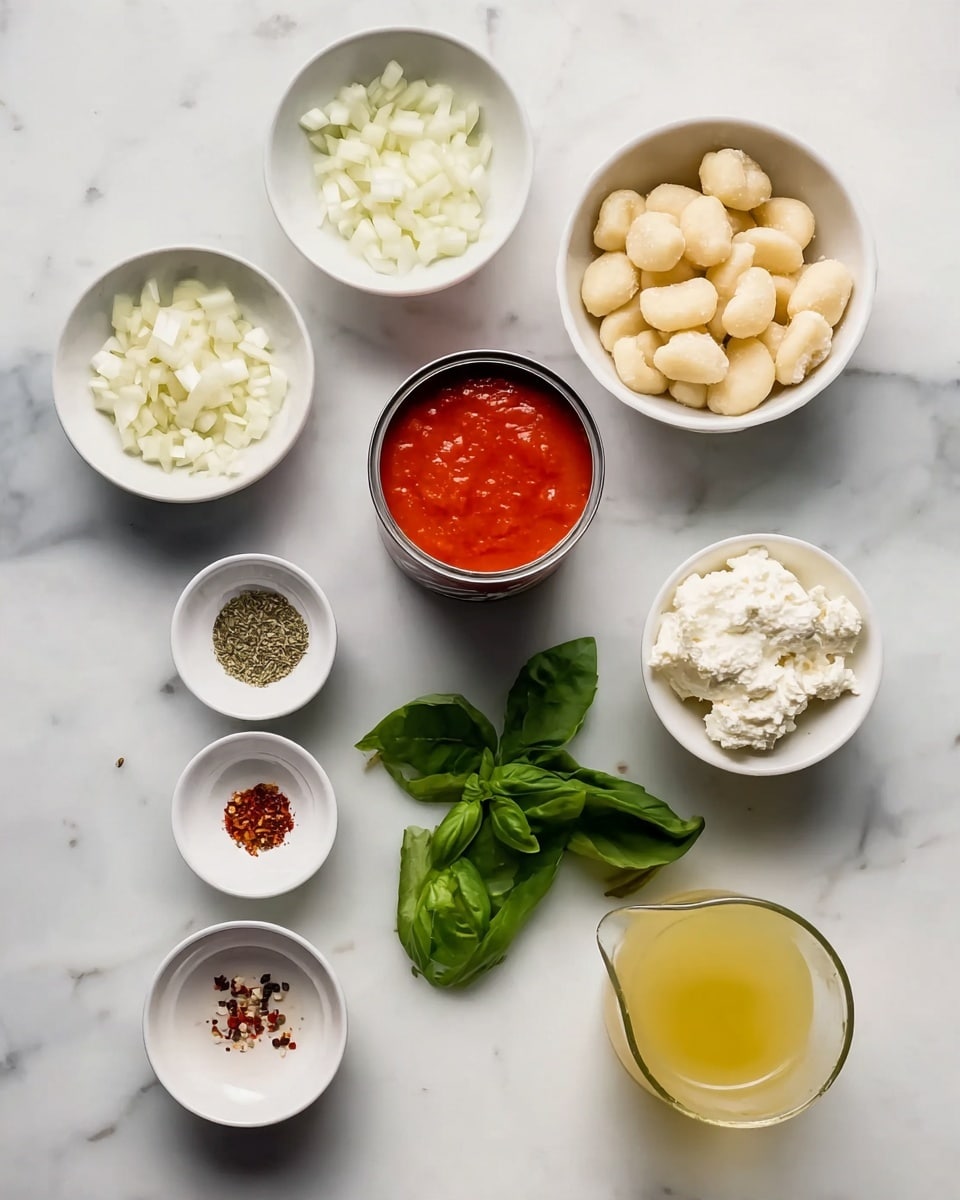 The image shows several white bowls and small containers placed on a white marbled surface. The top left bowl contains chopped white onions, to its right is a bowl with pale beige gnocchi. Below these bowls in the center is a small bowl filled with white ricotta cheese. To the right of the ricotta is an open can of bright red tomato sauce, spilling slightly on the rim. Below the tomato sauce are fresh green basil leaves spread out on the surface. To the left of the basil, there are three small white dishes: one with dried herbs, one with minced garlic, and one with red pepper flakes. At the bottom center, a small white bowl holds a yellowish liquid, possibly oil, and to the right is a clear jug filled with light yellow broth or stock. Photo taken with an iphone --ar 4:5 --v 7