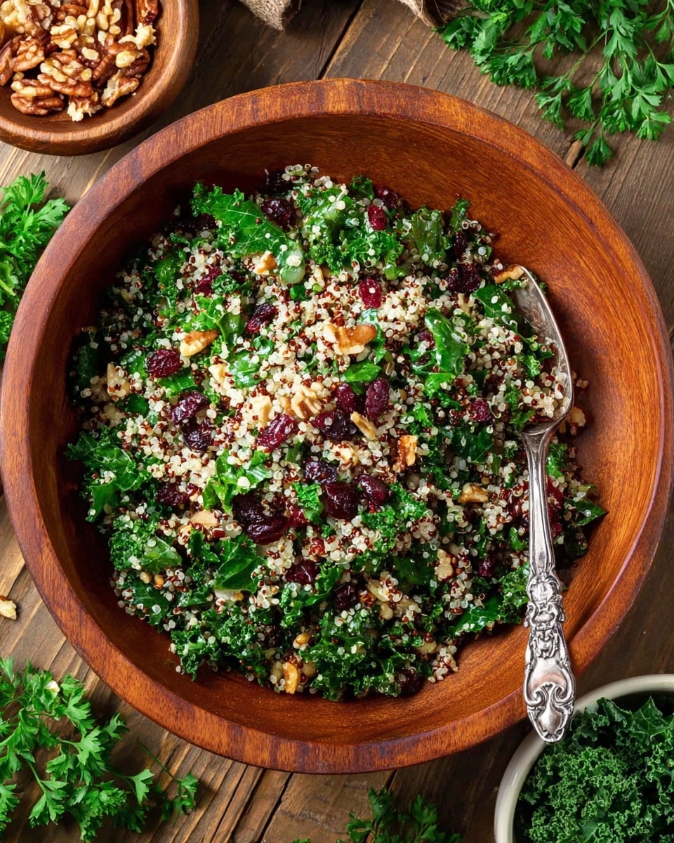 A wooden bowl filled with a mixed salad showing three main layers: the bottom layer of small white and red quinoa grains, the middle layer of chopped green kale leaves with curly edges, and the top layer scattered with dried dark red cranberries and small chopped brown nuts. In the salad, a silver fork with an ornate handle rests near the center. The bowl sits on a wooden surface with green parsley leaves around it, a small white bowl of kale in the bottom right, and a small wooden bowl with wooden flakes of nuts in the top left. Photo taken with an iphone --ar 4:5 --v 7