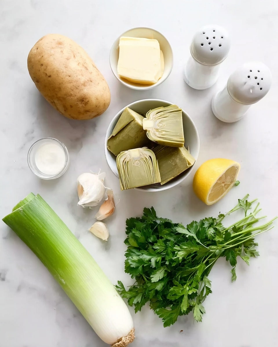 The image shows ingredients laid out on a white marbled surface, including a whole potato with a light brown skin, two garlic cloves with pale skin, and a leek with green and white parts placed at the bottom left. There is a small white bowl filled with pale yellow butter near the top, next to a pair of white salt and pepper shakers. A round white bowl in the center holds several light green artichoke hearts. Near the middle is a half lemon with bright yellow skin, and just below it, a bunch of fresh green parsley with leafy texture. To the right of the artichoke hearts is a small white container with a white liquid inside. photo taken with an iphone --ar 4:5 --v 7